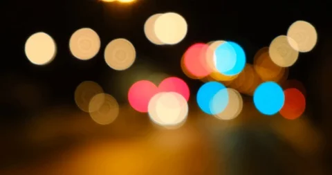 Soft defocused Huge bokeh balls from urban traffic lights dissolving while dr Stock Footage 124770531