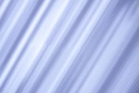 Soft diagonal shadows create a subtle geometric pattern on a neutral backgrou Stock Photos