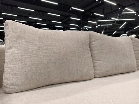 Soft divan with large throw pillows, perfect for any living room, available.. Stock Photos