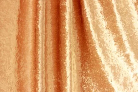 Soft drape of gold fabric Stock Photos