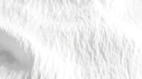 Soft draped white fabric texture background. Stock Photos
