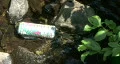 Soft Drink Can In River HD Footage
