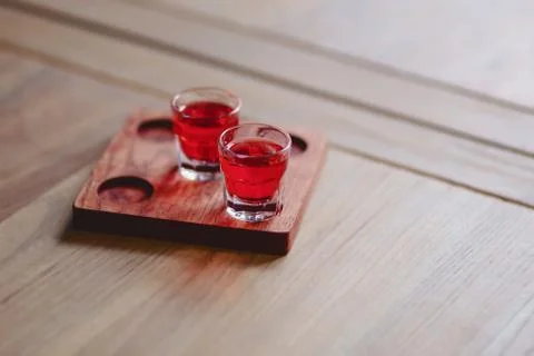 Soft drink of tender red in stacks on a wooden stand Stock Photos