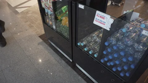 Soft drinks and water bottles in a show-case in front of duty-free shop in Stock Footage 155747001