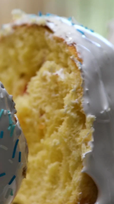 Soft easter sweet bread sliced by hand showing fluffy homemade texture and Stock Footage 346186644