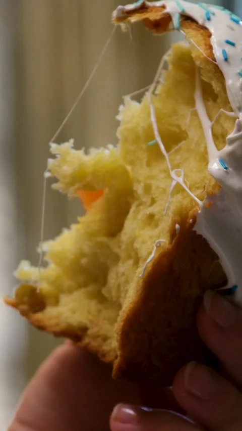 Soft easter sweet bread sliced by hand showing fluffy homemade texture and Stock Footage 346187812