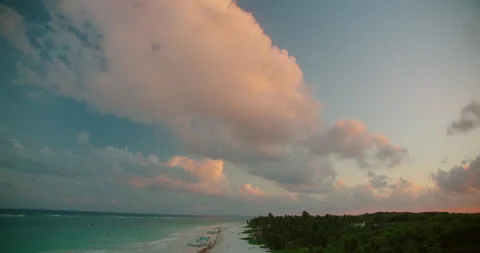 Soft evening cloud fills blue sky above tropical Caribbean coast in Tulum Mexico Video stock 344699882