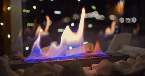 Soft, flickering flames from biofire add warmth and relaxation to quiet evening Stock Footage 300790300