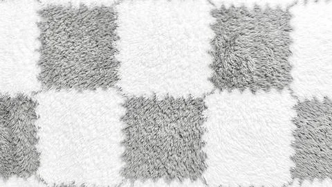 Soft fluffy checkerboard texture closeup in gray white alternating squares ev Stock Photos