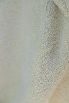 Soft, fluffy fabric texture in a light yellow tone Stock-Fotos
