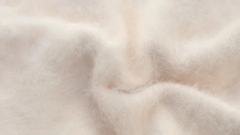Soft fluffy jersey rotates. Soft Wool background. Video stock 119983146