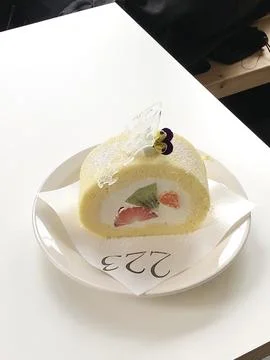 A soft, fluffy roll cake with a delicate sponge and creamy filling, perfect.. Stock Photos