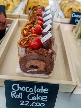 A soft, fluffy roll cake with a delicate sponge and creamy filling, perfect.. Stock Photos