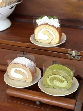A soft, fluffy roll cake with a delicate sponge and creamy filling, perfect.. Stock Photos