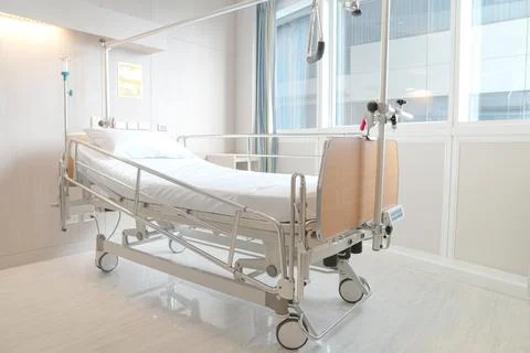 Soft focus background of electrical adjustable patient bed in hospital room Stock Photos