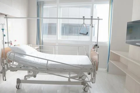 Soft focus background of electrical adjustable patient bed in hospital room Stock Photos