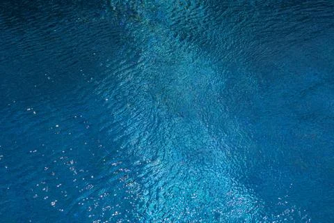 Soft focus background. Swimming pool water texture on a blue background. Stock Photos