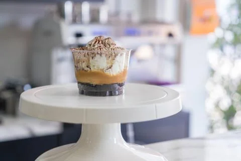 Soft focus of Banoffee cups  on Cake Decorating Turntable in coffee shop Stock Photos