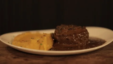 Soft Focus of Beautiful Meat with Puree Dish of Fancy Restaurant Stock Footage 129340689