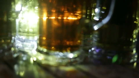 Soft focus, beer in close-up glass glasses. The glasses are reversed, real-time, Stock Footage 87426488