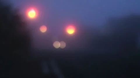 Soft focus blurred lights in fog, car with headlights on approaches Stock Footage 14815495