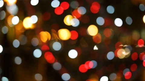 Soft focus, bokeh. Hard, high-contrast, bright image. Red yellow white lights gl Stock Footage 83249401