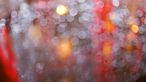 Soft focus, bokeh. The reflection in the water of festive illuminations. Colored Stock Footage 83249607