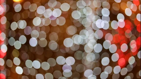 Soft focus, bokeh. White, grey, green lights flash on a black background. Framin Stock Footage 83249317