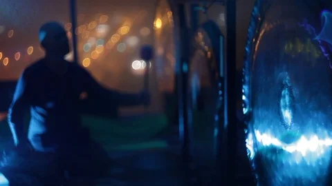 Soft focus bold man silhouette playing hanging gong Stock Footage 97182136