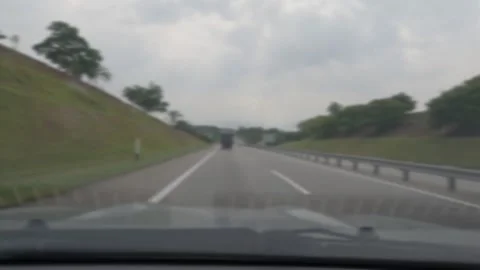 Soft focus of a car changing lanes to the right lane Stock Footage 313548147