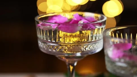 Soft Focus Champagne Scene with Floating Petals and Golden Light Video stock 344544448