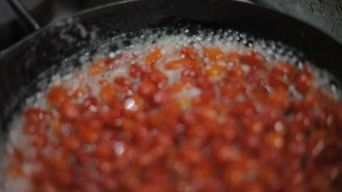 Soft Focus of Cooking a Sauce of Aromatic Red Chili Stock Footage 129340750