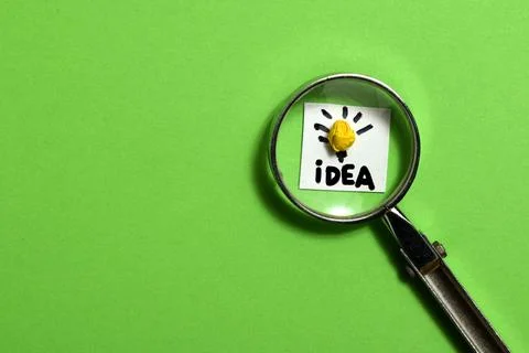 Soft focus, Creative idea concept, magnifying glass and light bulb icon Stock Photos