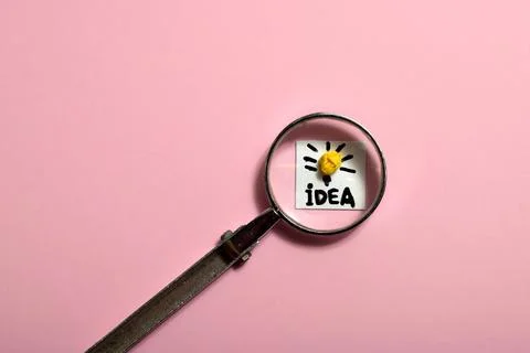 Soft focus, Creative idea concept, magnifying glass and light bulb icon Stock Photos
