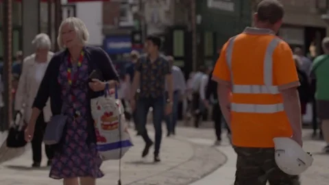 Soft Focus Crowds of shoppers in old English City 4K Stock Footage 77615338