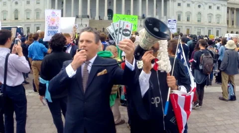 (Soft focus) Democracy Spring protesters mock corrupt political donors. Stock Footage 62274374