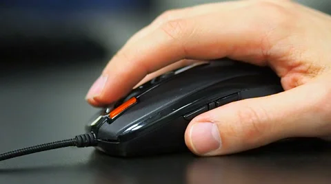 Soft focus to hand of the man clicking mouse. Right hand from left view 스톡 동영상 67216641