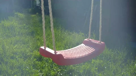 Soft Focus Image Of The Empty Swing In The Garden.  Stock Footage 155304861