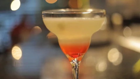 Soft Focus of Lemon and Starwberry Liquor Cocktail Stock Footage 128986937