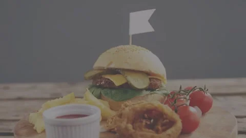 Soft focus lifting, camera panning, burger centering with sauce cup and fries, Stock Footage 333803191