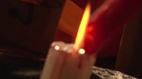 Soft focus melting red wax on white candle Stock Footage 68019321