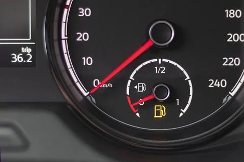 Soft focus. natural light. the dashboard. it is lit, the fuel level arrow sho Stock Photos