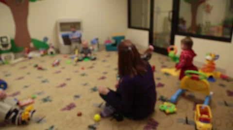 Soft Focus on Nursery Worker and Babies playing in the nursery Stock Footage 46095385