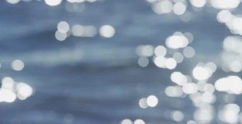 Soft focus Ocean Sparkles Stock Footage 128780947