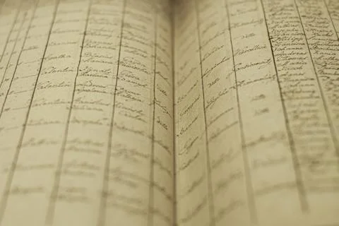 A soft focus of an old book of local records with list of residents' names an Stock Photos