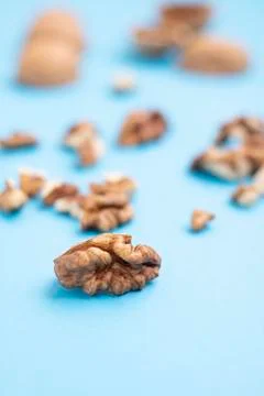 Soft focus of peel of walnuts, blurre background. Vertical Stock Photos