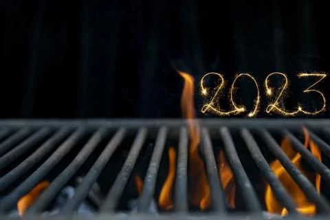Soft focus photo of an empty barbeque grill, 2023 written with fireworks Stock-Fotos