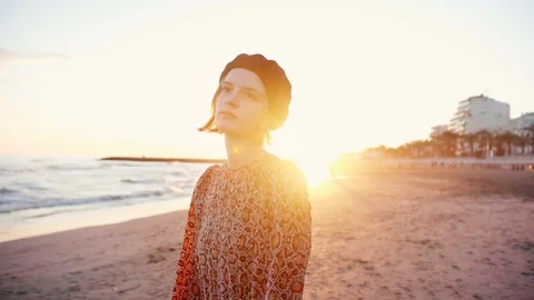 Soft focus portrait of beautiful blond girl on the beach in sunset light. Young Stock Footage 105746343