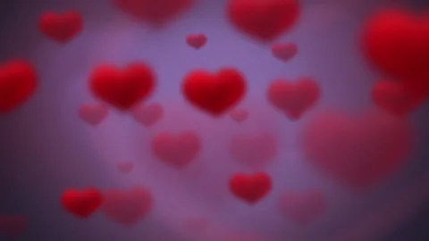Soft Focus Red Hearts on a Purple Background Conveying Love and Affection Stock Footage 306657186