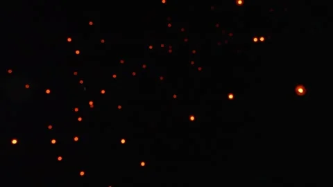 Soft Focus Sky Lanterns Drifting Upward in Dark Sky Stock Footage 327706187